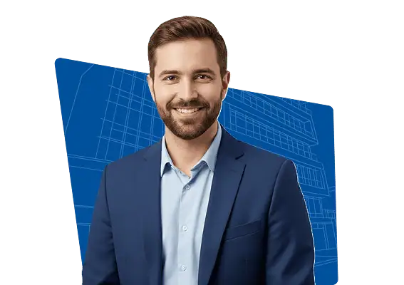 Smiling man with beard wearing a blue suit and light blue shirt in front of a blue architectural blueprint background.