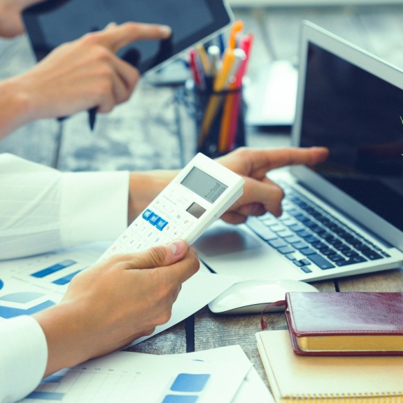 Budget calculating using laptop and calculator