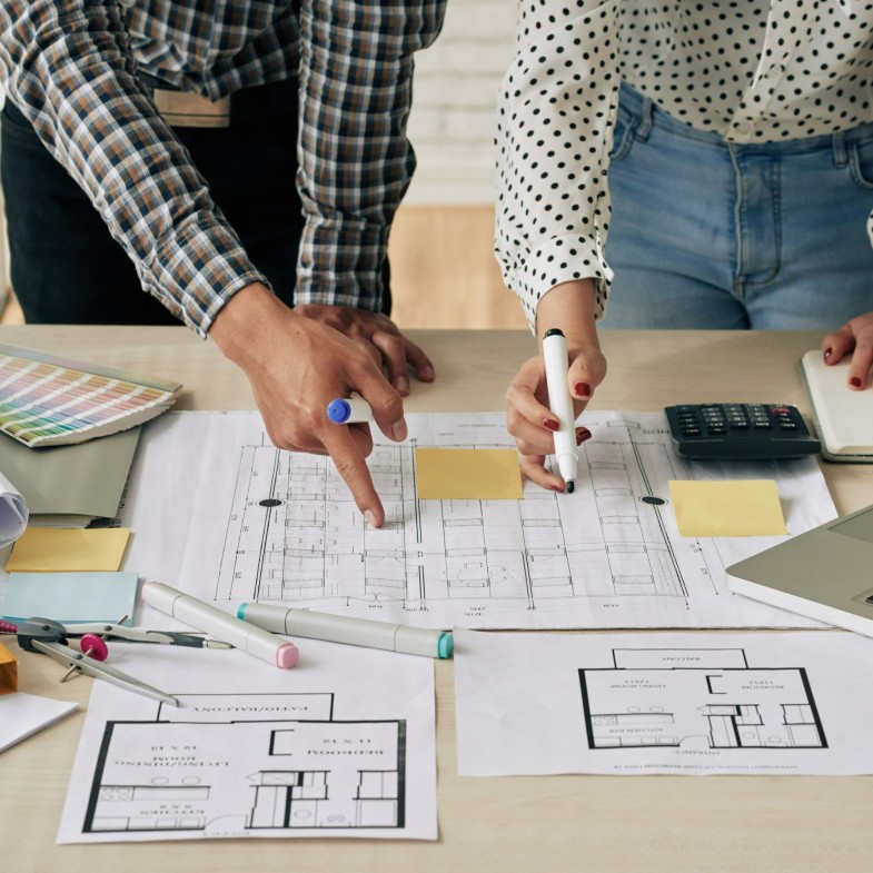 Engineers planning on a blue print